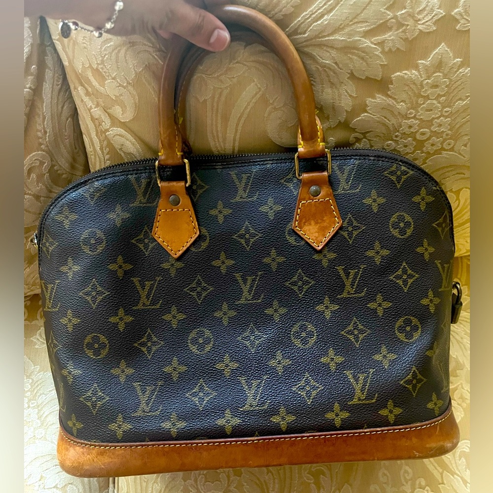 Louis Vuitton Alma Monogram Handbag